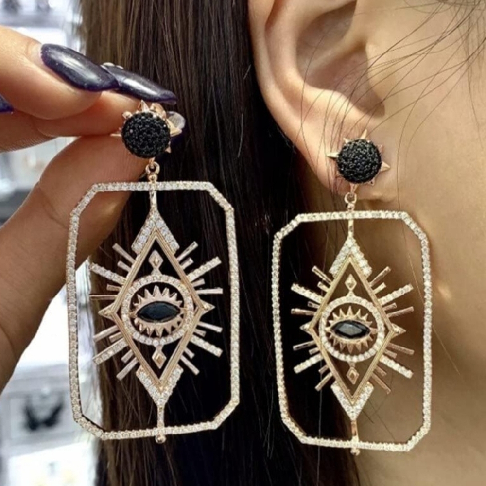 Swarovski's Tarot Magic special edition earrings, featuring mystical symbols l